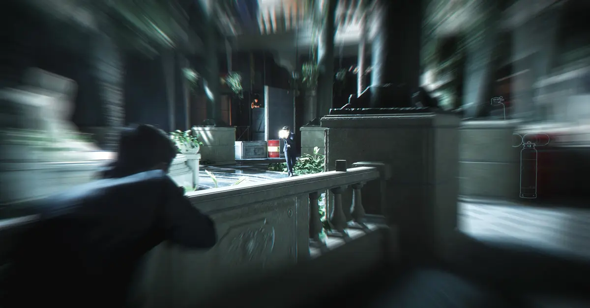 James Bond aiming a suppressed pistol in 007 First Light gameplay
