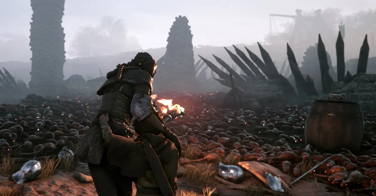 Amicia utilisant une torche pour repousser les essaims de rats dans A Plague Tale Innocence