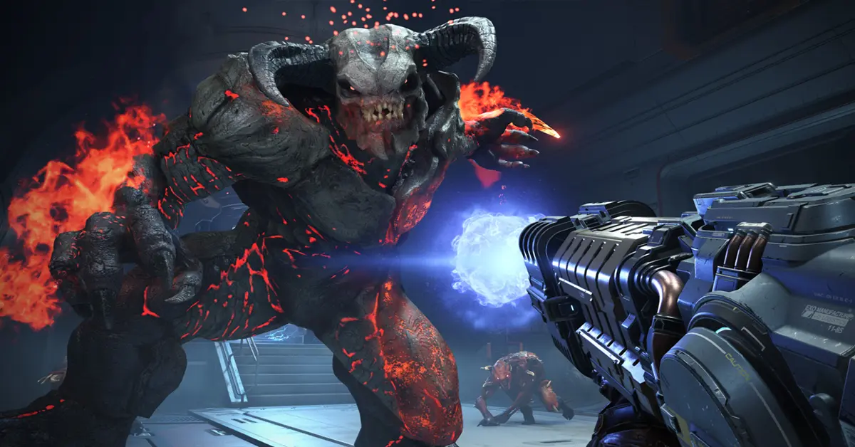 Vue à la première personne du Marine de DOOM effectuant un Glory Kill sur un Imp.