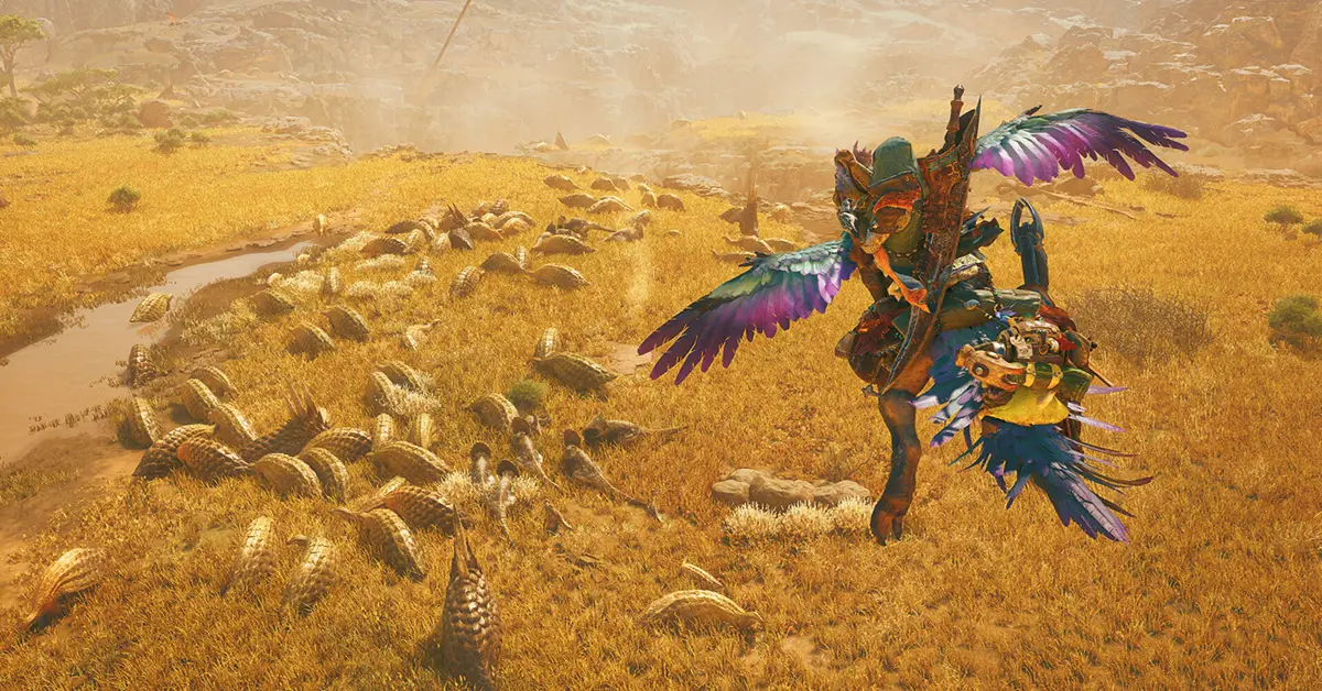 Un chasseur féroce chevauchant un Seikret tout en esquivant un monstre colossal dans Monster Hunter Wilds